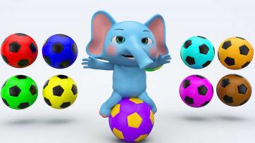 Ollie, the Elephant plays football with colourful balls